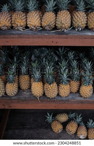 Fresh pineapple fruit stock in market display