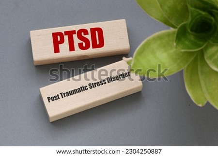 PTSD post traumatic stress disorder words on wooden blocks. Royalty-Free Stock Photo #2304250887