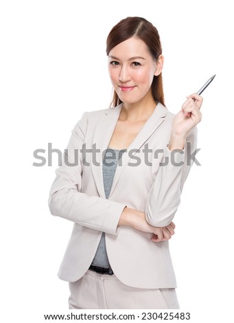 Businesswoman holding pen