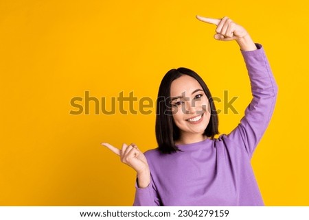 Photo of korean lady wear purple stylish shirt pointing fingers mockup useful tips get free delivery isolated on yellow color background