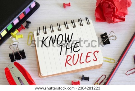 Know the rules symbol. Concept words Know the rules on white notebook. Beautiful wooden background. Business and Know the rules concept. Copy space.