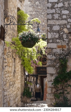 medieval mountain village, old town of Eze, France, streets with flowers, no people 