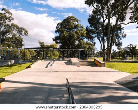 metal rail and skate ramps in a skate park in a natural environment Royalty-Free Stock Photo #2304303295