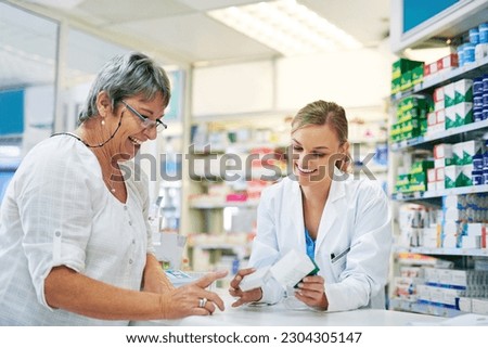 Pharmacist explaining prescription medication to woman in the pharmacy for pharmaceutical healthcare treatment. Medical, counter and female chemist talking to patient on medicine in clinic dispensary Royalty-Free Stock Photo #2304305147