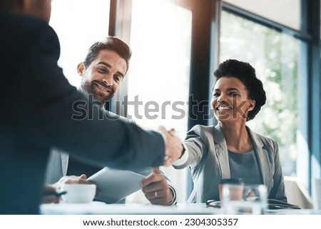 Business people, handshake and meeting for partnership, teamwork or collaboration in boardroom at office. Happy woman shaking hands in team recruiting, introduction or b2b agreement at the workplace Royalty-Free Stock Photo #2304305357