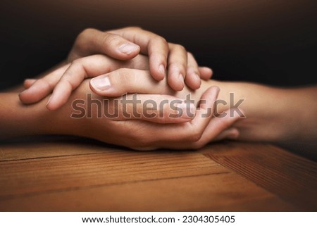 Closeup, love and holding hands for support, comfort and care with grief, loss and empathy. Zoom, people and friends with compassion, sympathy and healing with bonding, hope and trust with crisis Royalty-Free Stock Photo #2304305405