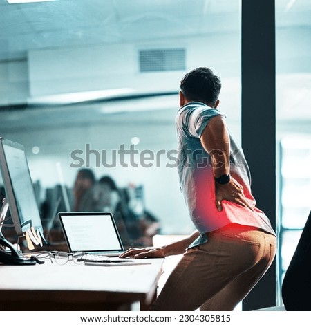 Back pain, injury and business man at desk with red muscle, health risk and fatigue in office. Uncomfortable employee with spine problem, bad posture and injured body with glow of burnout from stress Royalty-Free Stock Photo #2304305815