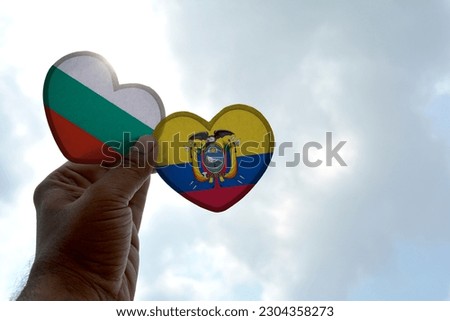 Hand holds a heart Shape Bulgaria and Ecuador flag, love between two countries