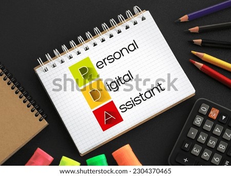 PDA - Personal Digital Assistant acronym on notepad, technology concept background Royalty-Free Stock Photo #2304370465