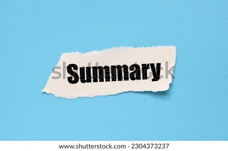 The word SUMMARY on a small piece of paper and a blue background. Royalty-Free Stock Photo #2304373237