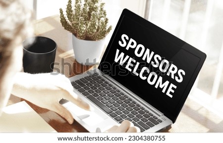 Businessman typing text Sponsors welcome in laptop on office background Royalty-Free Stock Photo #2304380755