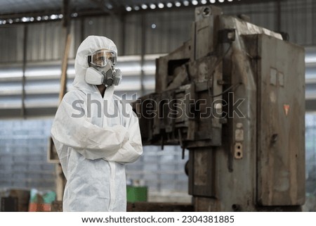 Chemical leak and safety first concept. Chemical specialist wear safety uniform, gas mask working in chemical dangerous area in the industry factory Royalty-Free Stock Photo #2304381885