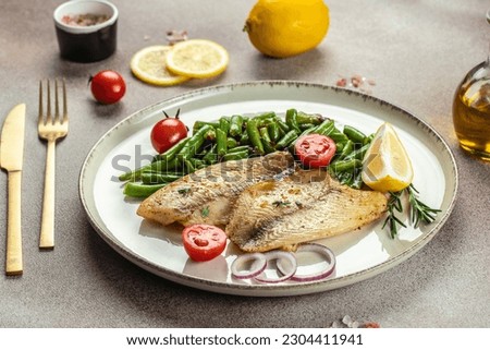 Baked white fish fillet Pangasius or tilapia with vegetables. banner, menu, recipe place for text, top view.