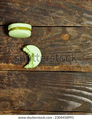 French pistachio macarons on wooden table