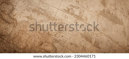 Fragment of an ancient globe. Old globe map background. A concept on the topic of sea voyages, discoveries, pirates, sailors, geography, travel and history.   Royalty-Free Stock Photo #2304460171