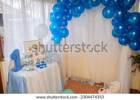 Sweet table and delicious cakes for first birthday. Candy bar with sweet cakes