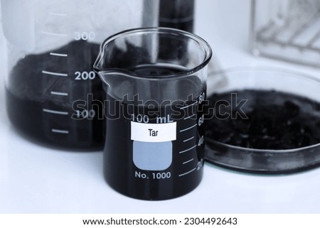Tar in container, Laboratory Quality Testing Concepts, Scientific experiments for industry Royalty-Free Stock Photo #2304492643