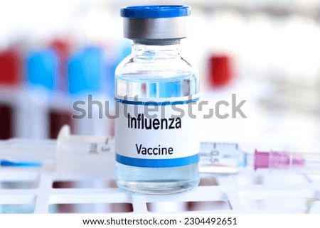 Influenza vaccine in a vial, immunization and treatment of infection, vaccine used for disease prevention Royalty-Free Stock Photo #2304492651