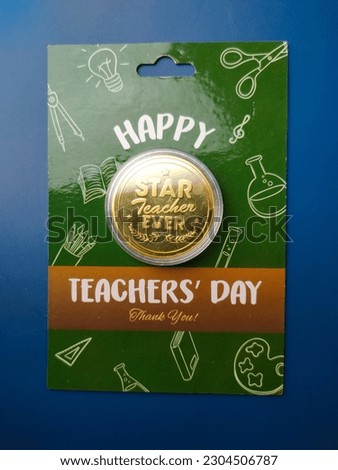 Top view Happy teacher day gift on a blue background