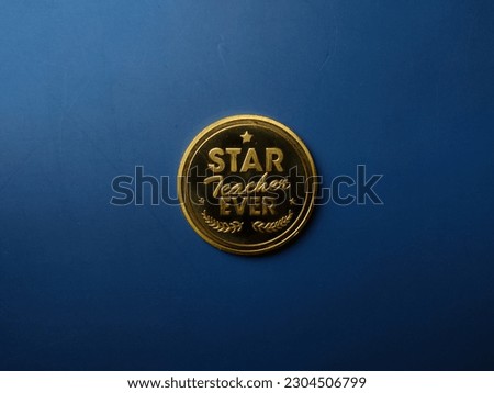 Gold coin gift for Happy teacher day on a blue background