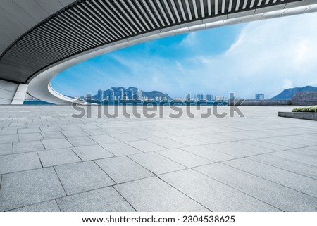 Empty square floor and bridge with skyline by the sea in Sanya, Hainan, China.