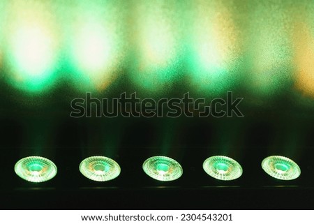 Futuristic bright lighting of stage spotlight. Photo is suitable for postcard design, template backgrounds, greeting card, posters.