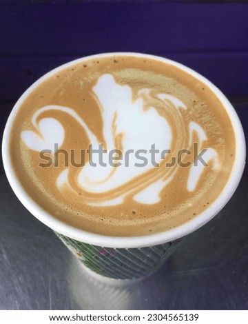 Cappuccino is a drink of Italian origin based on espresso with the addition of steamed milk, with a harmonious balance of the rich sweet taste of milk and espresso. with a picture of a swan in a cup