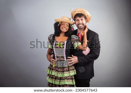 portrait, Brazilian couple in festa junina clothes. Saint John's festival.