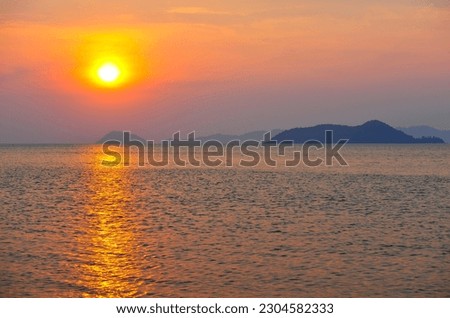 The beautiful sunset moment by the sea and islands, east region of Thailand, Ko Mak Island. Royalty-Free Stock Photo #2304582333