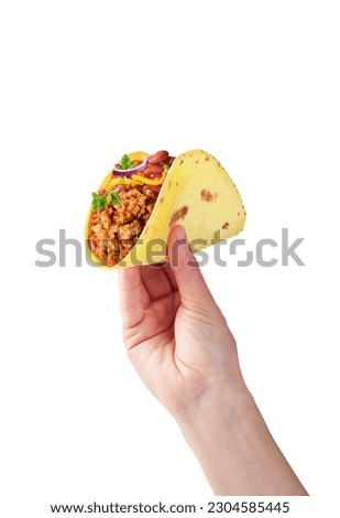 tacos with minced meat in hand on a white background Royalty-Free Stock Photo #2304585445