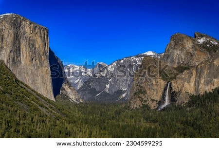 Scenic view of the Yosemite Valley from Tunnel View in the Yosemite National Park, Sierra Nevada mountains with snow in the spring in California, USA