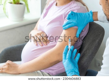A pregnant woman makes a vaccination. Selective focus. doctor.