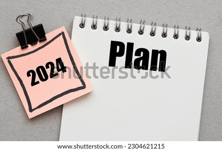 Plan 2024 words written in an office notebook. Concept in business. Plans for the new year.