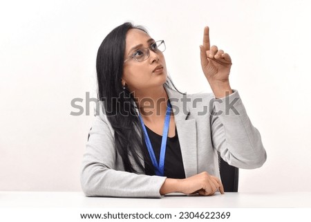 Portraits of young Indian  businesswoman sitting in office