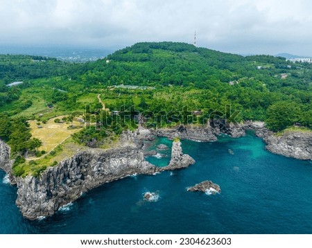 Aerial and summer view of Oedolgae Rock with volcanic rocks and cliff on the sea at Seohong-dong near Seogwipo-si, Jeju-do, South Korea
 Royalty-Free Stock Photo #2304623603