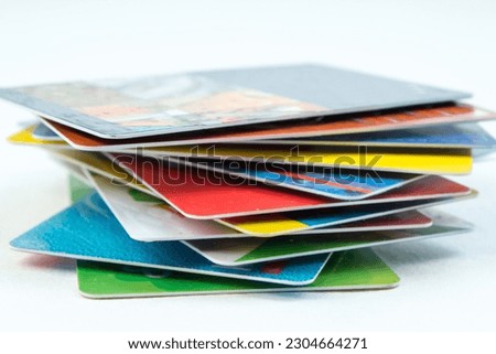 Stack of bank cards on a white background Royalty-Free Stock Photo #2304664271