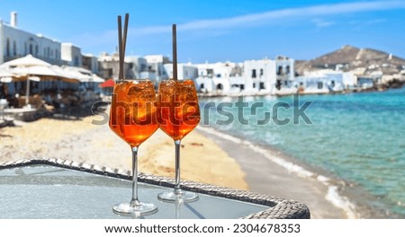 two aperol spritz on a summer evening in a mediterranean restaurant Royalty-Free Stock Photo #2304678353