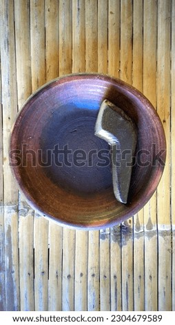 a photo of a traditional spice grinder in Indonesia.