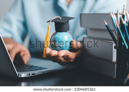 Graduation cap with Earth globe. Concept of global business study, abroad educational, Back to School. Education in Global world, Study abroad business in universities in worldwide. language study Royalty-Free Stock Photo #2304685361
