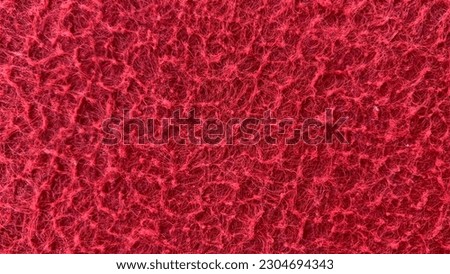 The photo captures a close-up of a vibrant red carpet texture. The red color, symbolizing passion and energy, creates a striking focal point, effortlessly complementing a variety of interior styles.