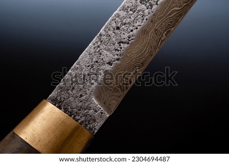 Damascus steel knives on a black background. Kitchen knives. background with japanese knife. A set of Japanese Damascus steel knives. Banner
