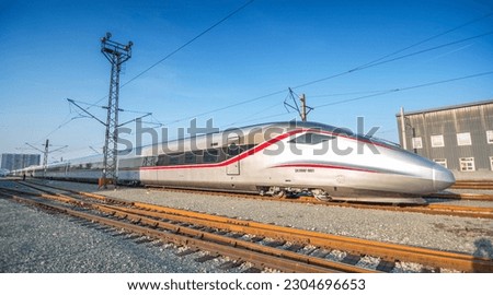 High-speed train running on railway. Royalty-Free Stock Photo #2304696653