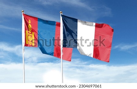 French flag and Mongolian flag. waving in the blue sky
