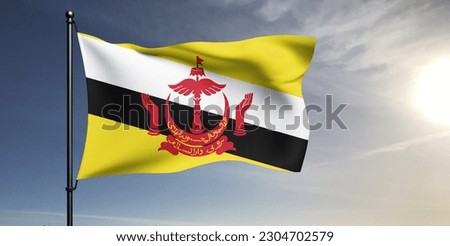 Brunei national flag cloth fabric waving on beautiful grey sky Background.