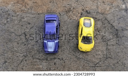 A close up of a purple and yellow toy car that has great detail