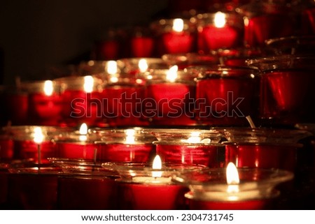 Closed Up Picture of Red Candles that is Lit Arranged Neatly