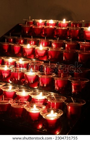 Closed Up Picture of Red Candles that is Lit Arranged Neatly