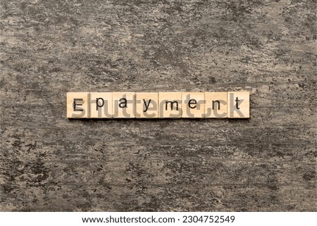 E-payment word written on wood block. E-payment text on cement table for your desing, concept.