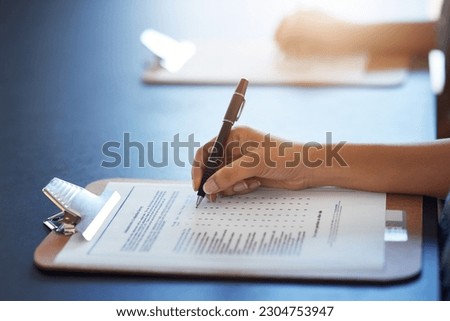 Clipboard, hands and writing on document with pen for survey on table mockup. Filling in paperwork, questions and woman with application form, checklist or test, examination and review for assessment Royalty-Free Stock Photo #2304753947
