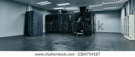 Server room, empty or data center for internet connection, computing network or cyber security hardware. IT support background, information technology or machine equipment with laptop in a datacenter